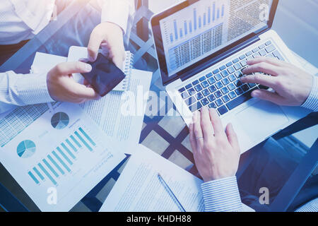 business intelligence concept, team of people working on charts and data, meeting in the office, graphs analysis Stock Photo