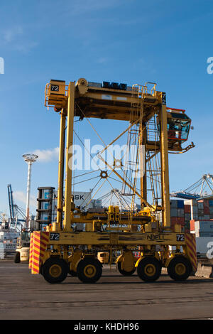 AUCKLAND, NEW ZEALAND - 17th APRIL 2012: One Noell straddle carrier and stack of Maersk containers at Auckland sea port. Stock Photo