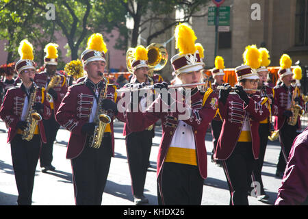 High School marching band plays and marches up 5th Avenue in the Veterans Day Parade in New York City. Stock Photo