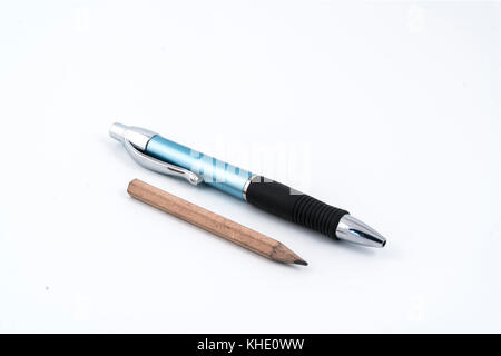 a ballpoint pen and a pencil on a white background Stock Photo