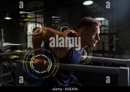 man doing triceps dip on parallel bars in gym Stock Photo