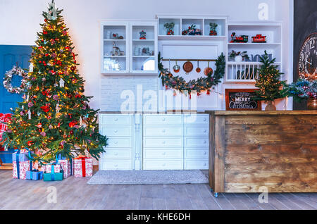 Christmas living room with a Christmas tree, gifts. Dining room. Beautiful New Year decorated classic home interior. Winter background Stock Photo