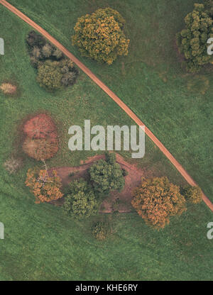 Aerial view of footpath leading through trees in the English countryside Stock Photo