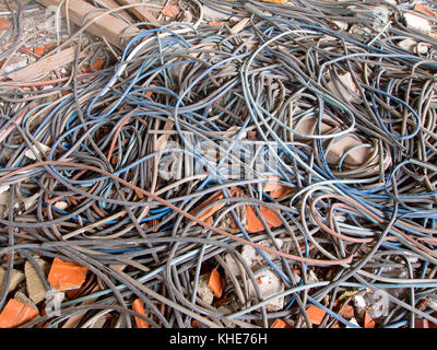 Old electric power cables. Tangled on floor. Stock Photo