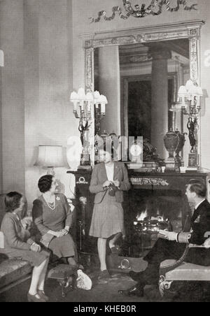 The British Royal Family at home.  From left to right, Princess Margaret, future Countess of Snowden, 1930 – 2002. Younger daughter of King George VI and Queen Elizabeth of the United Kingdom and sister of Queen Elizabeth II. Queen Elizabeth, The Queen Mother.  Elizabeth Angela Marguerite Bowes-Lyon, 1900 – 2002.  Wife of King George VI and mother of Queen Elizabeth II. Princess Elizabeth of York future Elizabeth II, 1926 - 2022. Queen of the United Kingdom. George VI, 1895 – 1952.  King of the United Kingdom and the Dominions of the British Commonwealth. Stock Photo