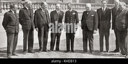 Members of the War Cabinet of the All Party Government during WWII, from left to right, Mr. Morrison (Home Office), Lord Woolton (Reconstruction), Sir John Anderson (Exchequer), Mr. Attlee (Deputy Prime Minister), King George VI, Winston Churchill (Prime Minister), Mr. Eden (Foreign Affairs), Mr. Lyttelton (Production), and Mr. Bevin (Labour). Stock Photo