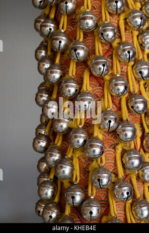 Nara, Japan - May 31, 2017:  Small prayer bells to draw attiontion of the spirits in the Todai-ji Temple Stock Photo