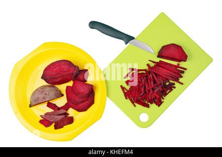 To cook a tasty vegetable soup beet  must be finely chopped into small stripes. Isolated on white top view shot Stock Photo