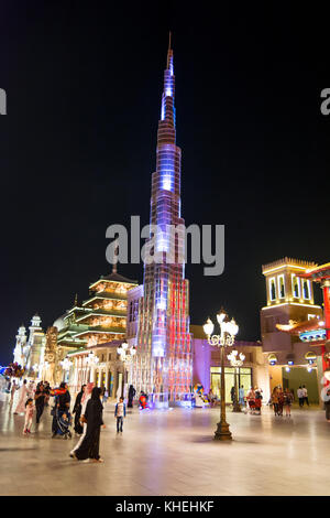 DUBAI, UNITED ARAB EMIRATES - NOVEMBER 6, 2017: Miniature Burj Khalifa at Global village at night. Popular tourist attraction in Dubai with shops and  Stock Photo