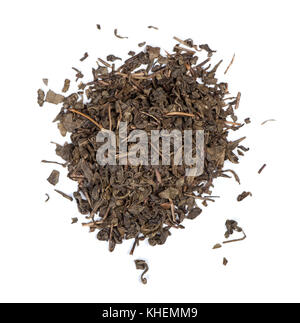 Heap of black tea leaves isolated on white background Stock Photo
