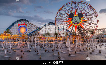 Ferris Wheel Mickey's Fun Wheel and Roller Coaster California Screamin', in front Lake Paradise Bay with water fountains Stock Photo