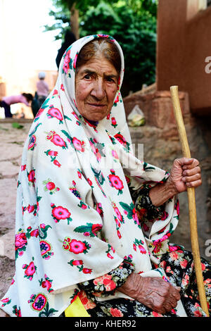 Old woman with tied chador, Abyaneh, Iran Stock Photo