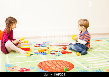 Kids playing with toys Stock Photo
