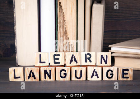 learn language, wooden letters on wooden table. Education, success and communication background Stock Photo