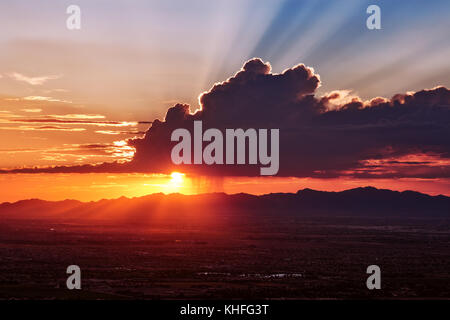 Dramatic crepuscular rays at sunset over the desert near Phoenix, Arizona Stock Photo