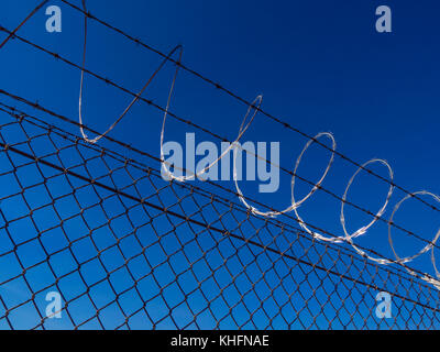 Femce with barb wire close up shot Stock Photo