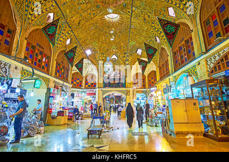 TEHRAN, IRAN - OCTOBER 11, 2017: The interior of the courtyard of Grand Bazaar - Timcheh-e Hajeb-od-Dowleh, with scenic domes, decorated with Persian  Stock Photo