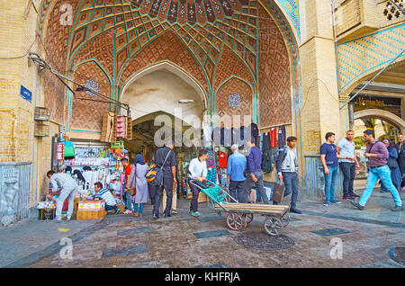 TEHRAN, IRAN - OCTOBER 11, 2017: The crowded area at the central portal of Grand Bazaar (Bazaar e Bozorg) in Sabzeh square, on October 11 in Tehran. Stock Photo