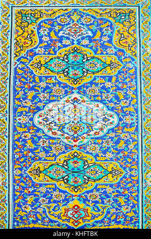 The facade wall decoration of Karim Khani Nook - the panel of colorful glazed tiles, covered with fine floral Persian ornamentation,  Golestan, Tehran Stock Photo