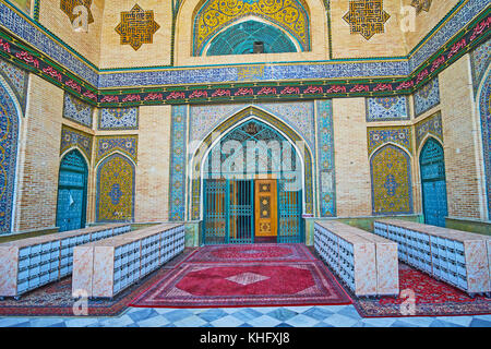 TEHRAN, IRAN - OCTOBER 11, 2017: The main entrance of Shah's Mosque with tiled patterns on the brick wall, on October 11 in Tehran. Stock Photo