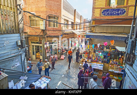 TEHRAN, IRAN - OCTOBER 11, 2017: The crowded intersection of Grand Bazaar, people visit stationery and book stores, on October 11 in Tehran. Stock Photo