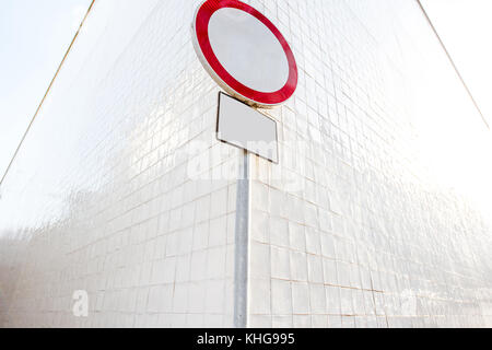 Forbidden road sign on the wall background Stock Photo