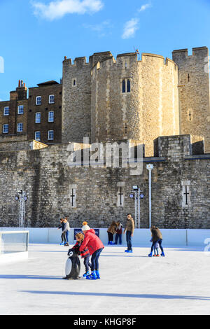 Tower of London, UK. 17th Nov, 2017. People enjoy the first ice skating session of the season at the Tower of London ice skating rink, as it opens to the public on its first day this year, in blazing sunshiner. The rink in the popular setting at the historic Tower of London landmark attracts tourists, Londoners and local families alike. Credit: Imageplotter News and Sports/Alamy Live News Stock Photo