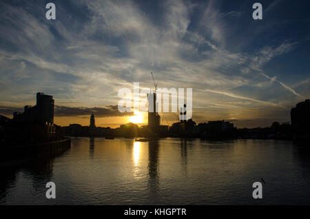 London, UK. 17th Nov, 2017. UK Weather. Sunset over the Thames and Chelsea Wharf taken from Battersea Bridge. Credit: JOHNNY ARMSTEAD/Alamy Live News Stock Photo