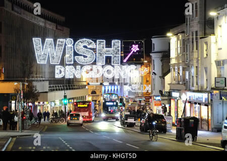 Brighton, UK. 17th November 2017. The Christmas shopping season is underway in Brighton East Sussex with the festive lights switched on with yuletide words in lights strung across North Street in the city. Credit: Nigel Bowles/Alamy Live News Stock Photo