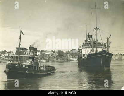 1 251248 Tugboat Coringa is assisting the passenger ship Ormiston to berth in Brisbane Stock Photo