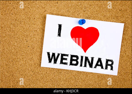 Hand writing text caption inspiration showing Webinar concept meaning Love Online Training Development Business Workshop written on sticky note, remin Stock Photo
