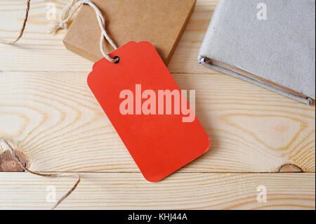 Large Price red Tag red tag on a golden wooden background Stock Photo