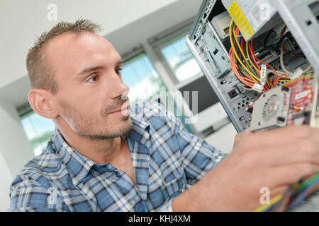 engineer repairs computers hard drive Stock Photo