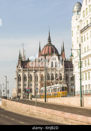 Tram outside the Hungarian Parliament Building (Országház) in Budapest, Hungary. Stock Photo