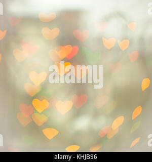 abstract defocused heart shaped lights background space for copy text Stock Photo