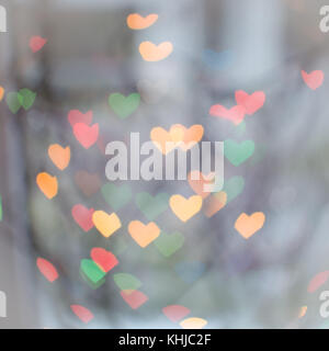 abstract defocused heart shaped lights background space for copy text Stock Photo