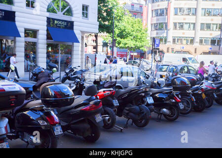 PARIS, FRANCE - CIRCA JUNE 2014: Mopeds parked in street Stock Photo