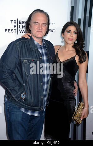 NEW YORK, NY - APRIL 28: Quentin Tarantino, Courtney Hoffman attends 'Reservoir Dogs' 25th Anniversary Screening during 2017 Tribeca Film Festival at The Beacon Theatre on April 28, 2017 in New York City  People:  Quentin Tarantino, Courtney Hoffman  Transmission Ref:  FLXX Stock Photo