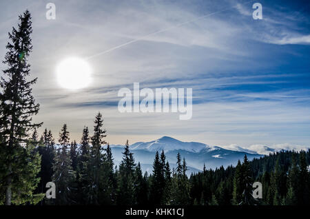 Winter snow covered mountain peaks and trees in Ukrainian Carpathians, Europe. Great place for winter sports, hiking Stock Photo