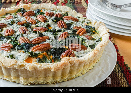 Vegetarian homemade squash pie with spinach, blue cheese and pecan. Stock Photo