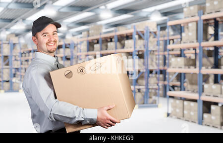 delivery man hold box in warehouse Stock Photo