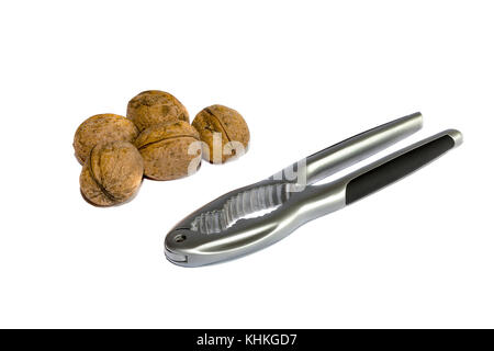 Group of walnuts and nutcracker, isolated on white background Stock Photo