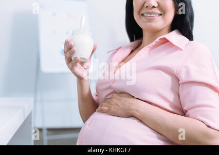 Close up of big belly that sitting in semi position Stock Photo