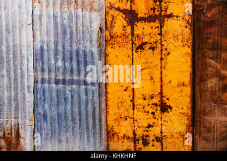 Rusty and grunge metal plates and galvanized corrugated iron sheets as a wall background Stock Photo