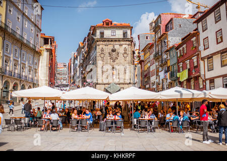 PORTO, PORTUGAL - September 25, 2017: View on the Ribeira square with tourists sitting at the bars and restaurants in Porto city, Portugal Stock Photo