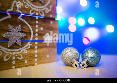 Christmas decoration balls with blurred color lights Stock Photo