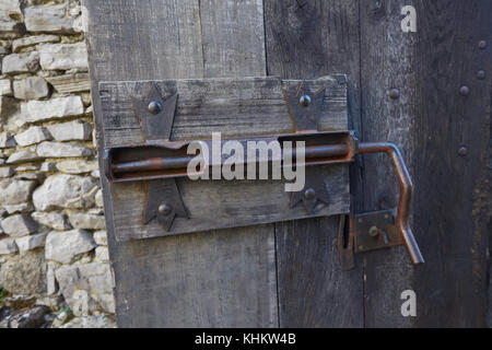 The wooden courtyard door latch, Castello Di Vezio, Varenna, Lake Como, Italy. Stock Photo