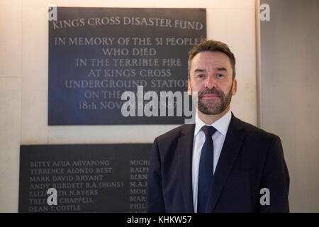 Managing Director of London Underground Mark Wild stands in front of a remembrance plaque as he discusses the 30th anniversary of the King's Cross fire which claimed the lives of 31 people in 1987, at the station in London. Stock Photo