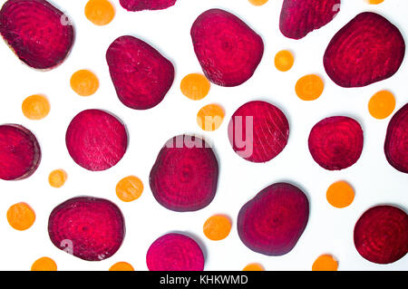 Raw beet and carrot slices isolated on white background Stock Photo