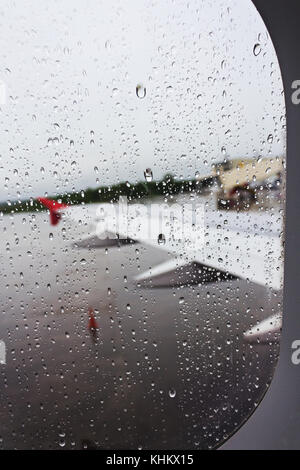 Rain drops on the window of the plane Stock Photo